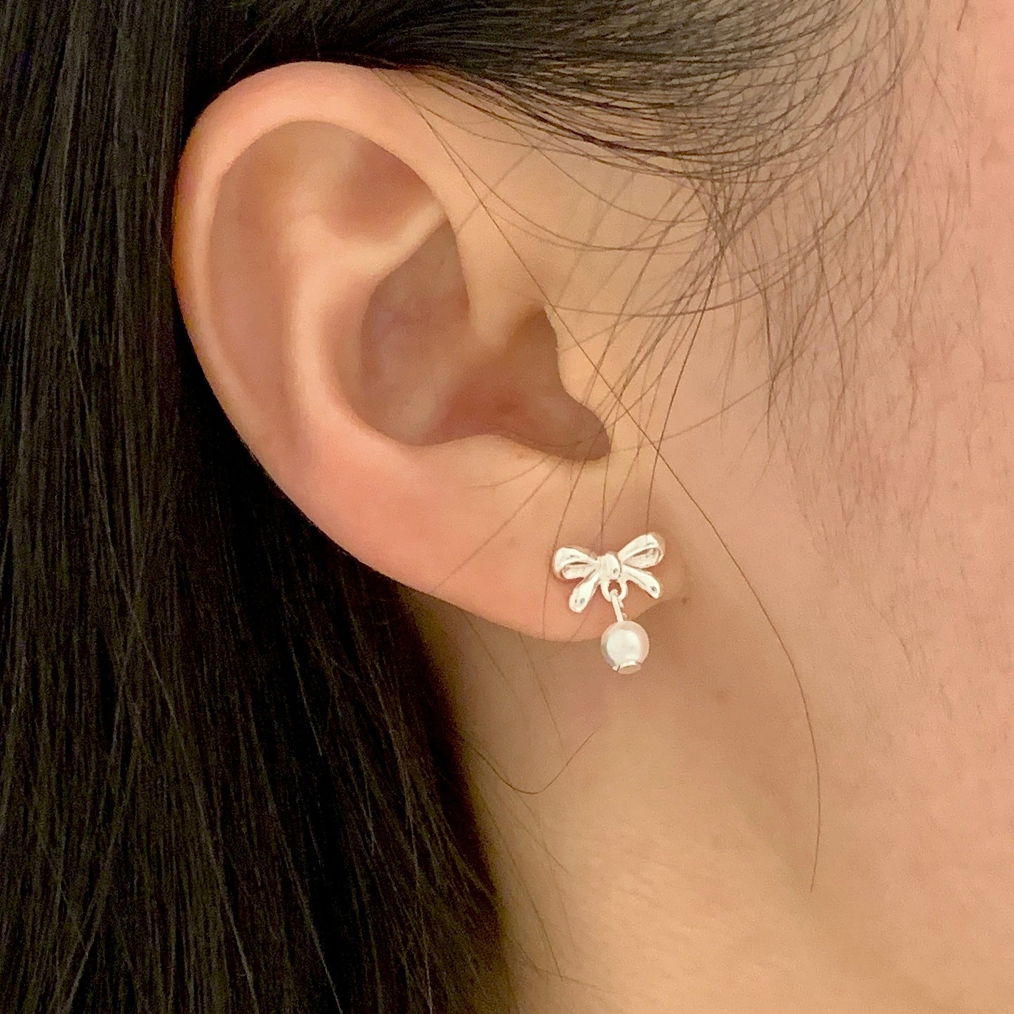pearl silver bow earrings