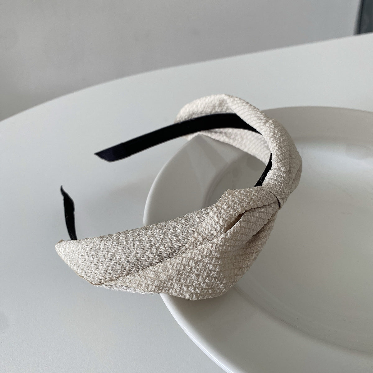 cream-colored woven headband
