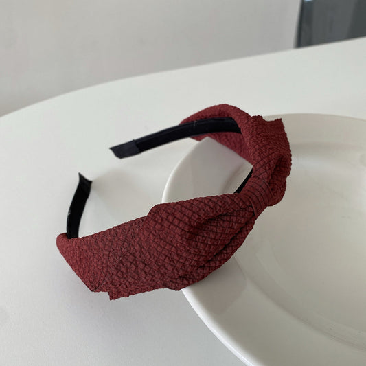 burgundy headband with a twisted knot